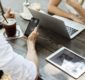 Photograph of a man and woman browsing online.