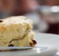 Photo of a scone with dried fruit.