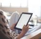 Woman reading an eBook at home.